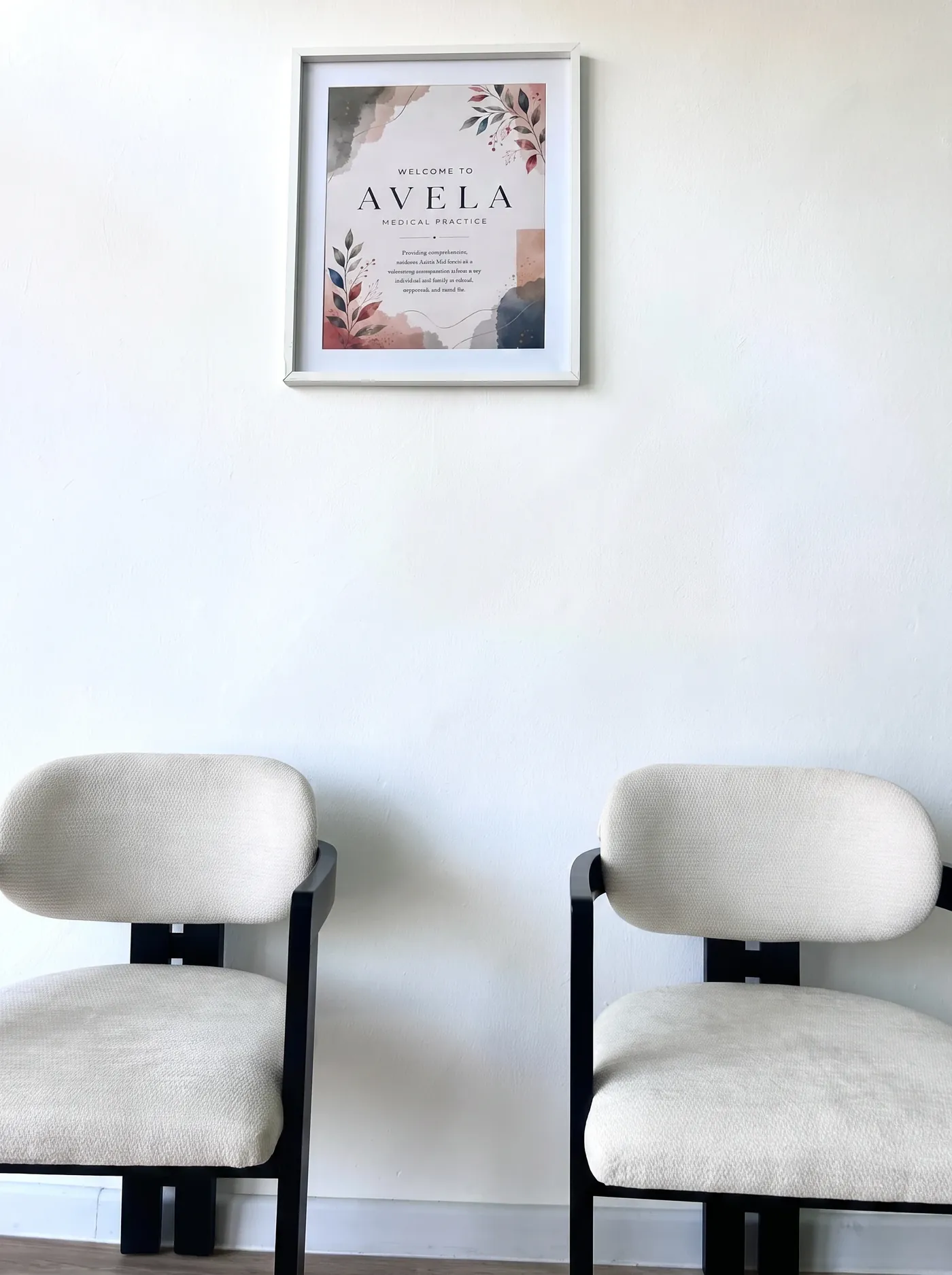 Waiting area with upholstered seating beneath a framed welcome print